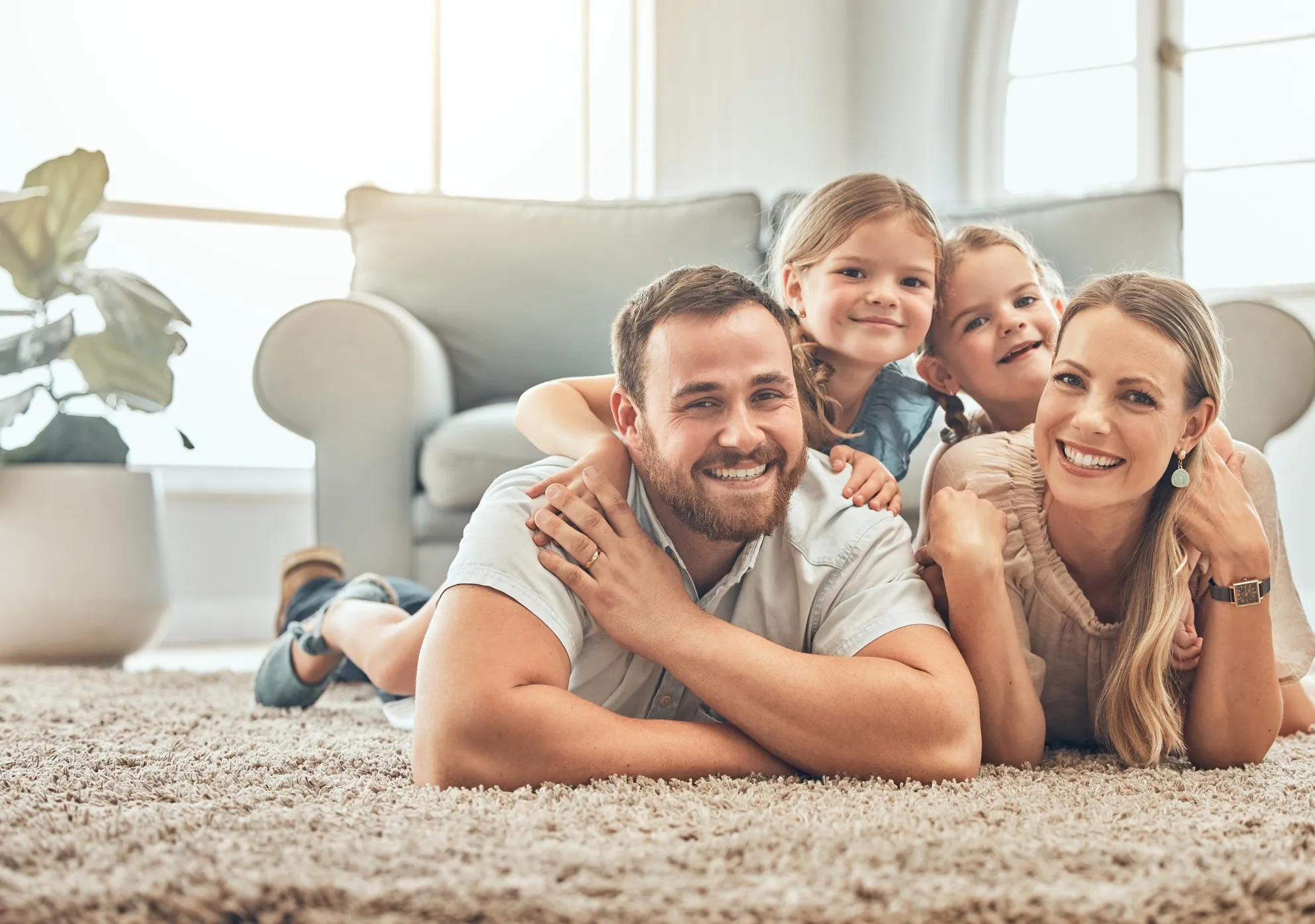 Family smiling because of clean carpet